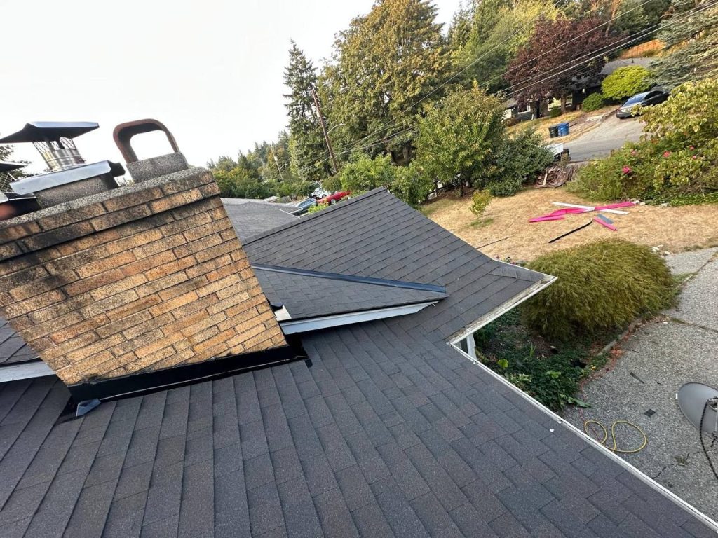 Heron 09 chimney flashing and valley on a shingle roof