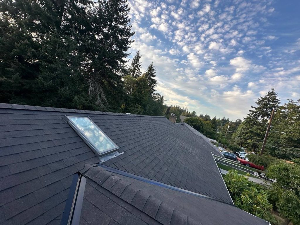 Skylight flashing set into an asphalt shingle roof